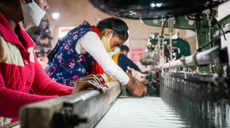 Panipat textile recycling workers sorting rags