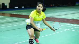 Aakarshi Kashyap playing badminton focusing on precision and control