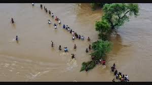 Jharkhand school flood rescue operation with boats saving stranded students from rooftop