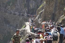 Pilgrims climbing Pissu Top during the Amarnath Yatra