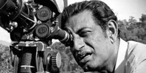 Satyajit Ray in front of his ancestral home